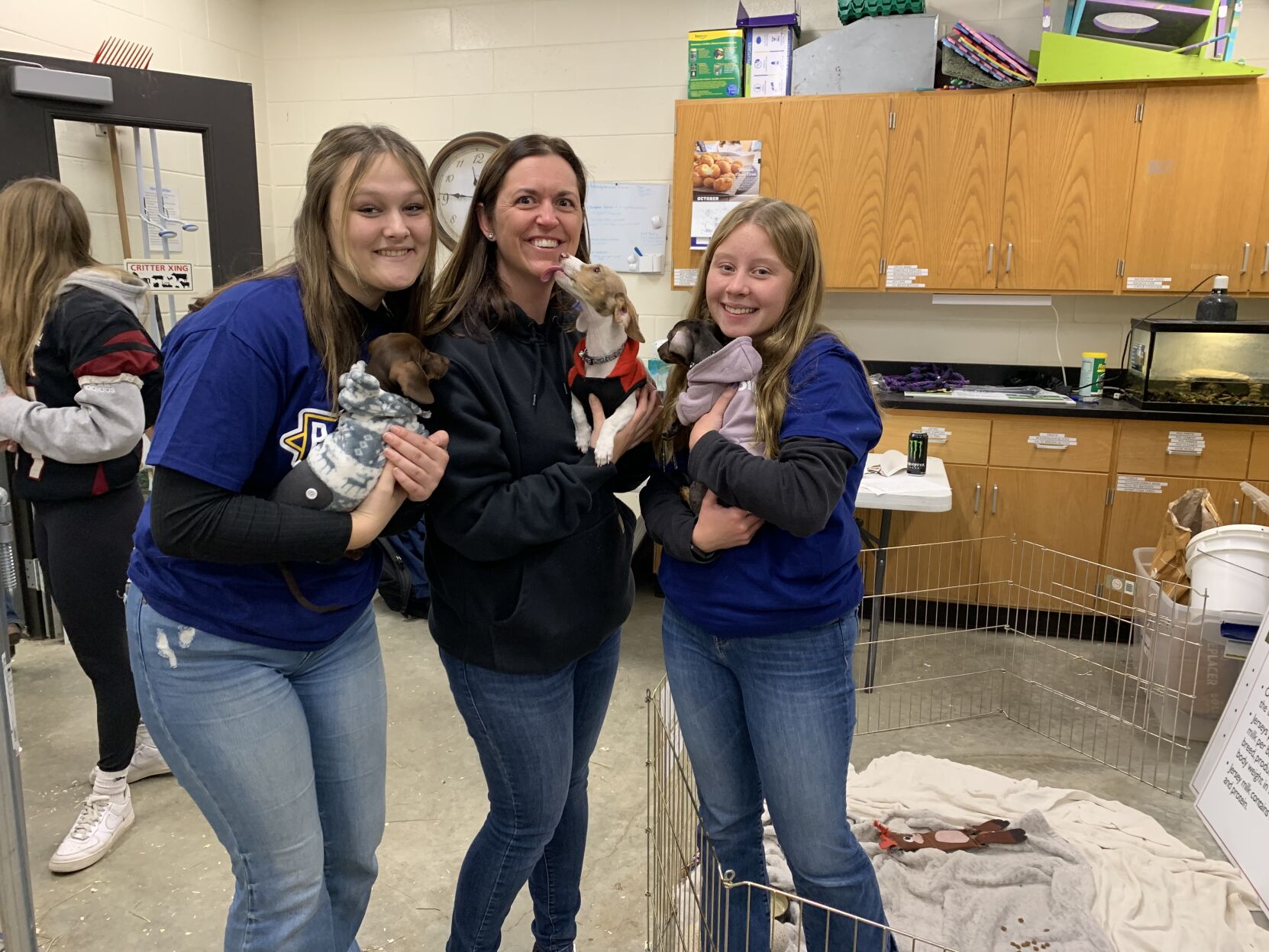 Mallory Annen, Candice Franks and Ila Keizer hold their pups at Ag Science Day